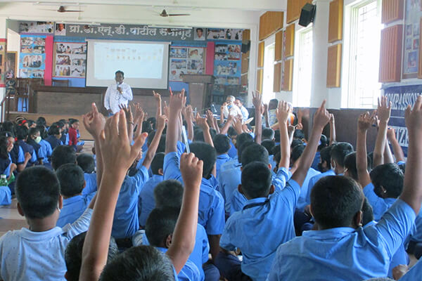 Children listen intently as they learn about animals.