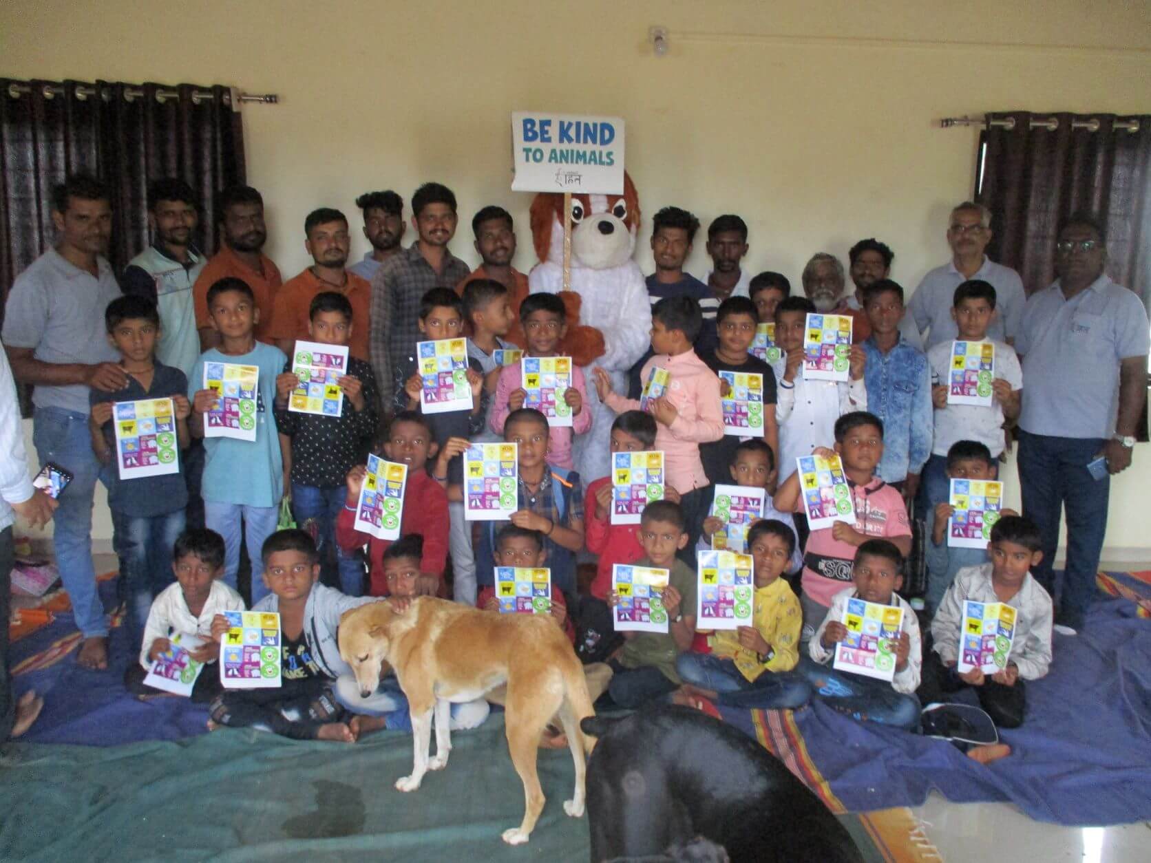 The students pose for a group photo with the Compassionate Citizen mascot and sanctuary resident Rossy.