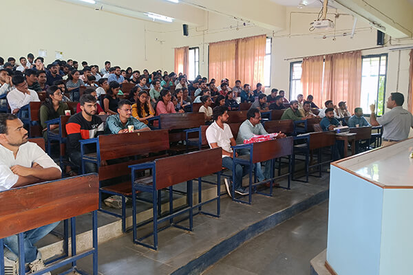 Students listen as an Animal Rahat veterinarian explains the painless castration method.