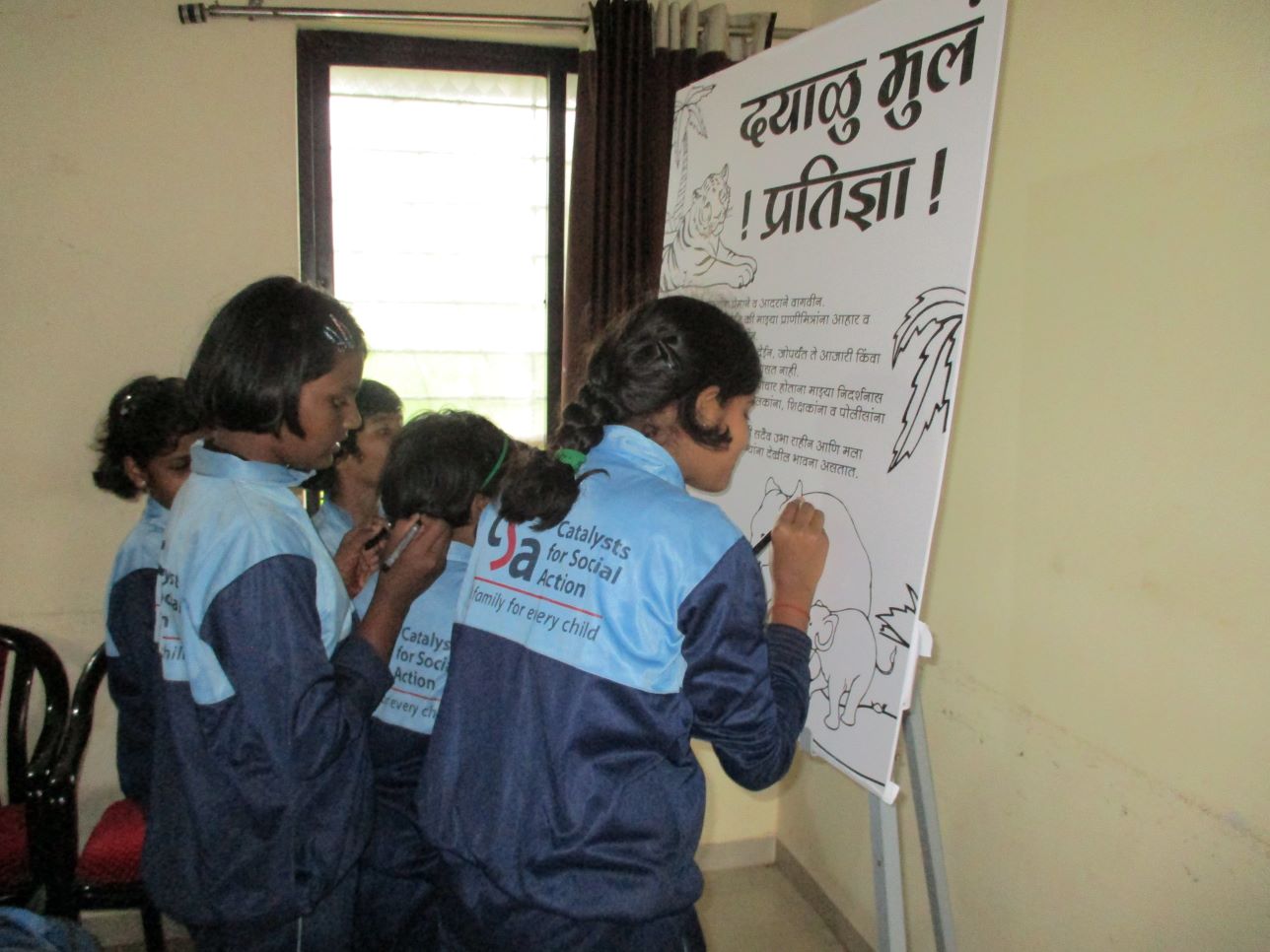 Students pledge that they will always be kind to all animals.]