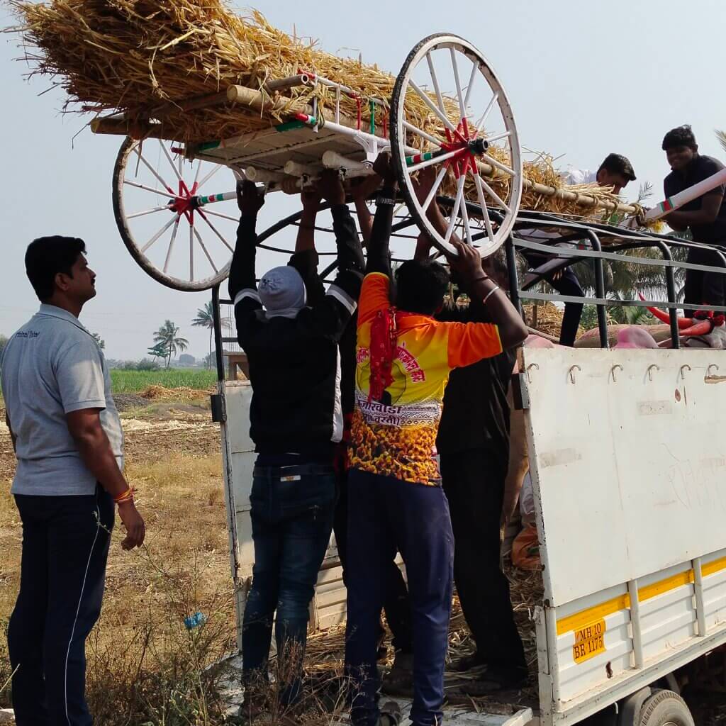 Animal Rahat staff load the cart and the bullock into a truck to be transported back home.