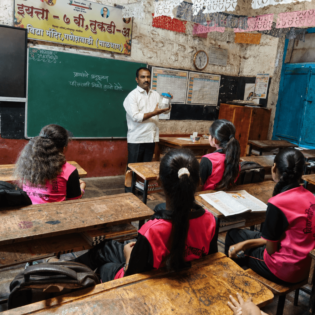 Mr. Sachin explains the importance of safely disposing of plastic jars to prevent animals from getting their heads trapped in them.